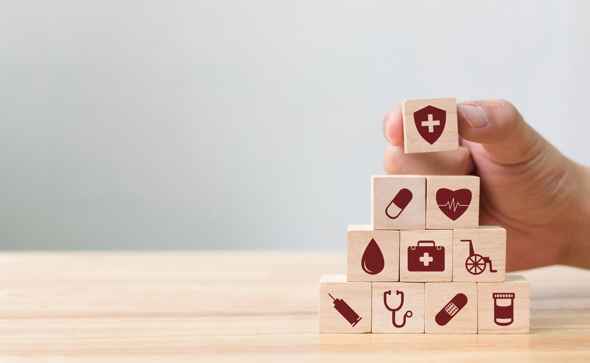 Hand arranging wood block stacking with icon healthcare medical, Insurance for your health concept